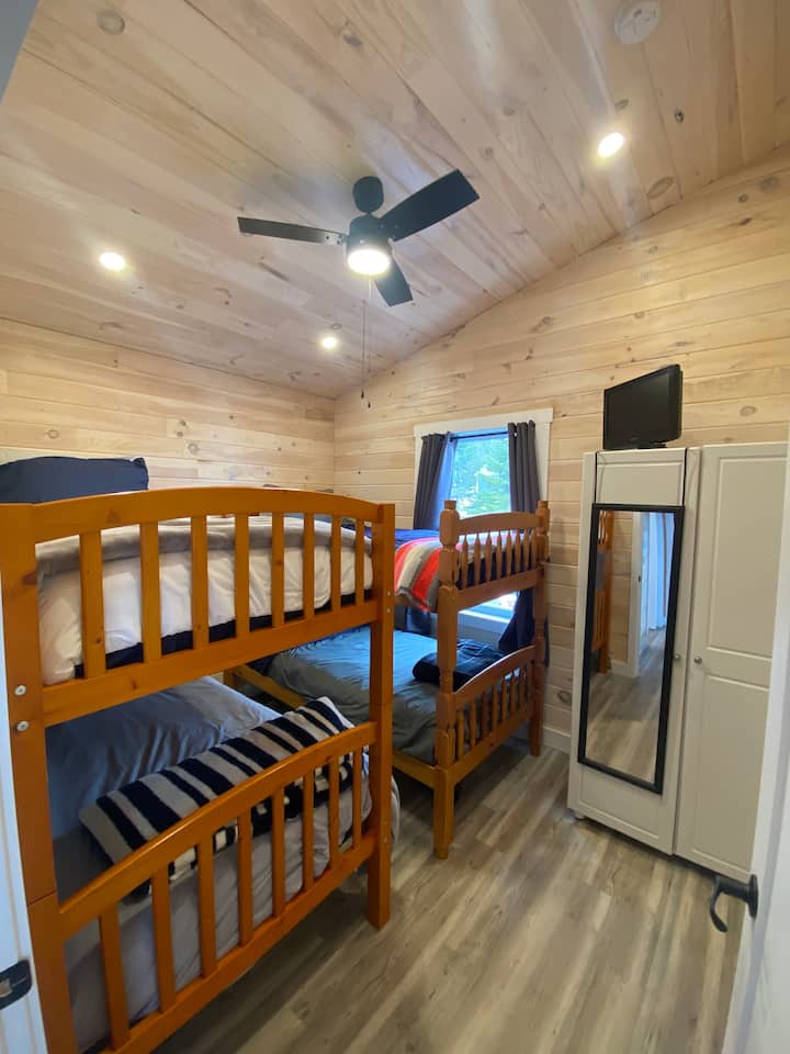 Cosy bunk room. 4 single bunks but no ladder or rails, this set up accommodates our teenagers but if your traveling with toddlers you may want to bring along a bunk rail. 