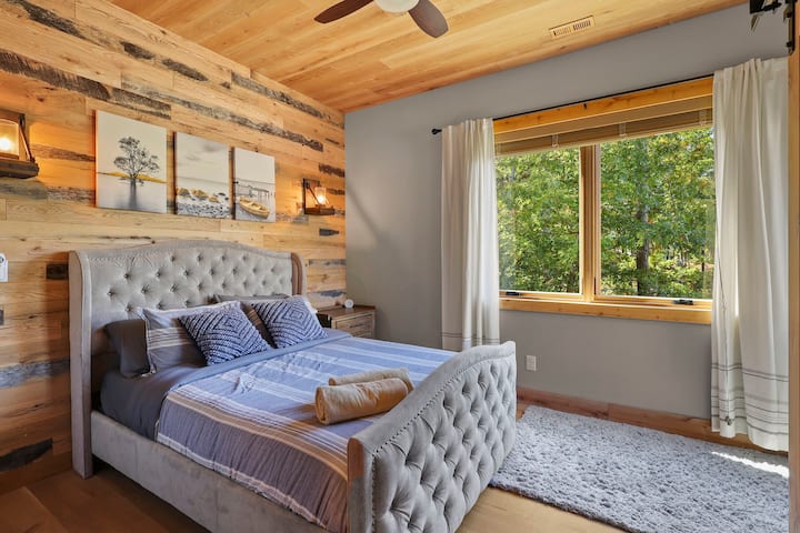 Lower level bedroom 3 with queen bed (firm mattress) and lake view