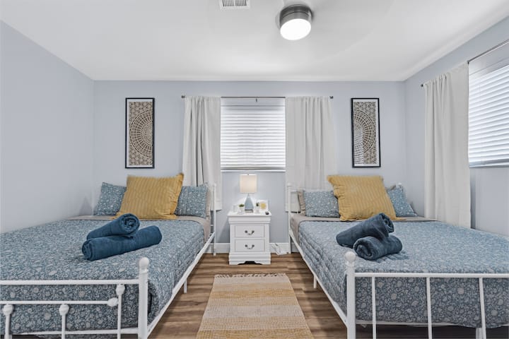 Third bedroom with two queen beds, HD TV, and sitting area. Comfortable enough for extra quests or perfect for children!