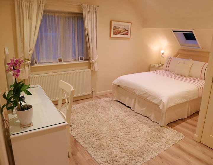 Luxury double bed in the Riley suite