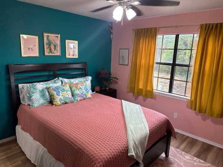 Queen bed with amazing outside views.