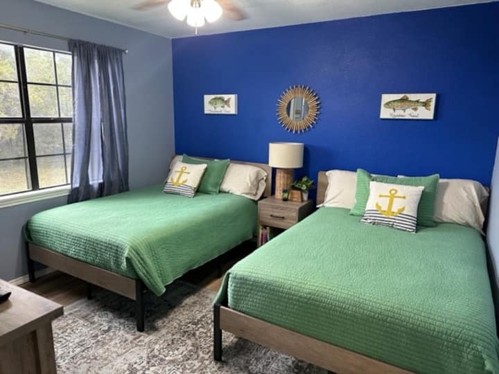 Bass fishing room with two full size beds.
