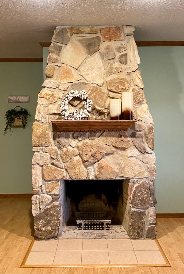 Wood burning fireplace located in the living room of the cottage. Perfect for a cold winter nights’ stay with family over the holidays. 