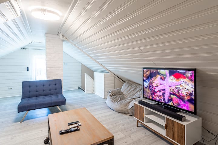 A unique corner under the roof, perfect for relaxing and enjoying a good movie.