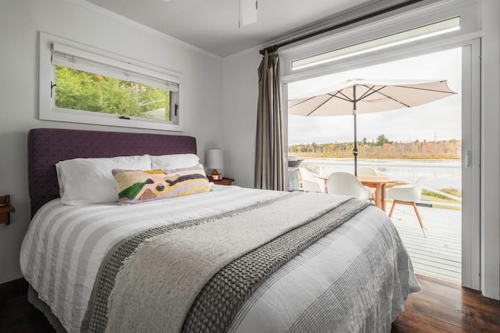 Another view of master bedroom with French doors leading to the lake. 