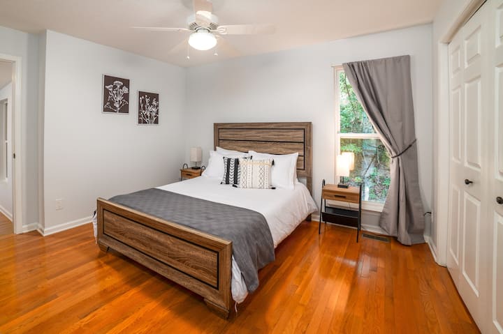 Main level bedroom with queen bed 