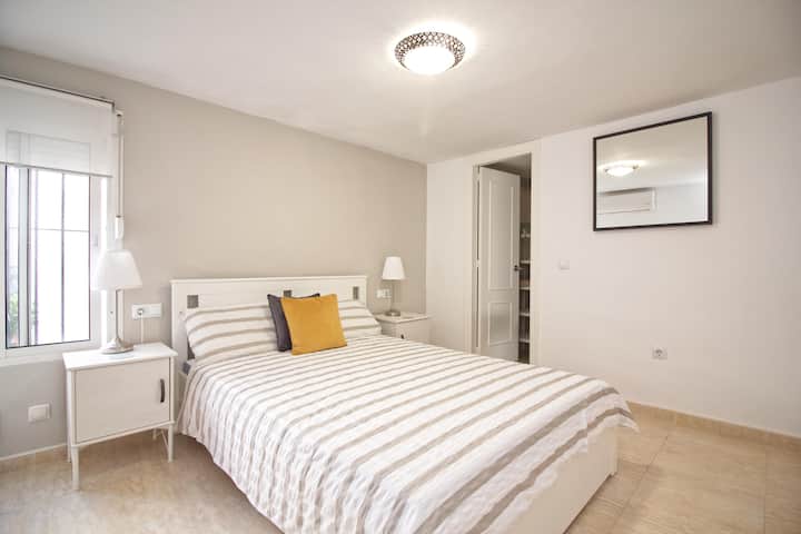 Second Double Bedroom Featuring Double Bed with Air-Con & Wardrobes for Storage.