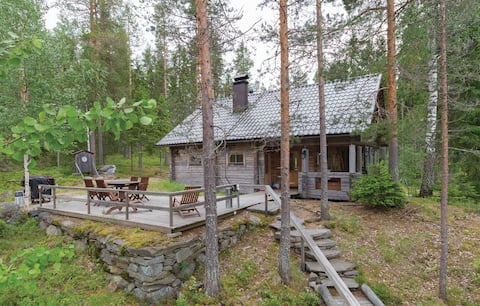 Traditional log cabin on the shore of a quiet lake