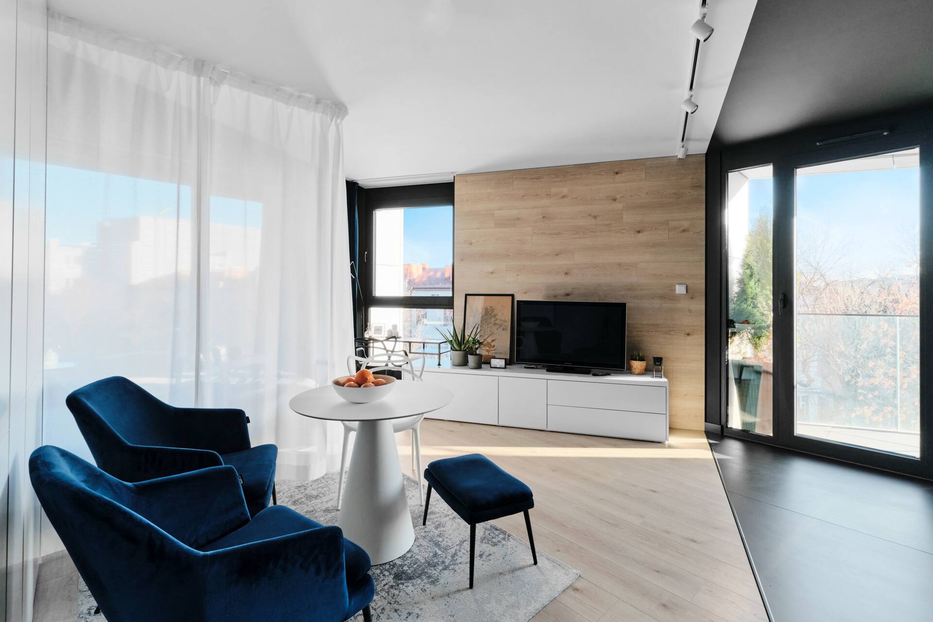 Modern studio with a pool and a hot tub