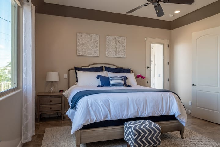 Master bedroom access to the back patio and pool.