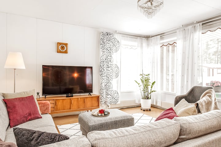 Cozy living room with SmartTV and Finnish design interior welcomes you to relax with friends and family