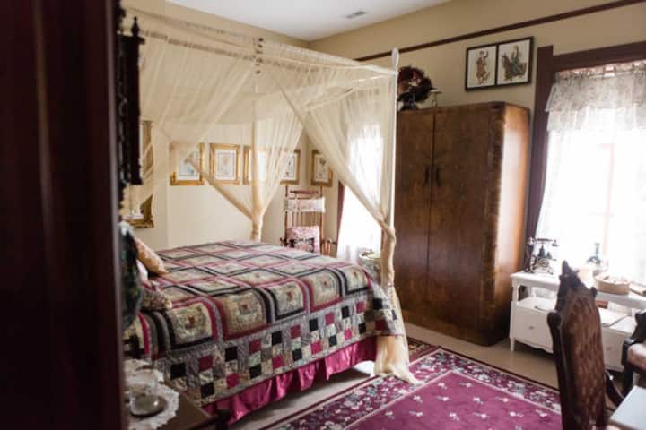This room has a queen-size bed with a private bathroom. 

It is located on the upper level of the Inn with staircase access. This bedroom is one of the ten uniquely designed bedrooms available at the Totten Trail Inn.