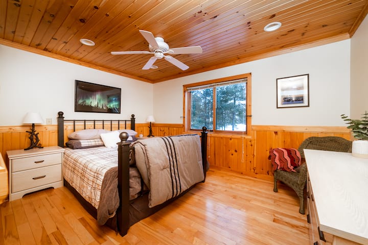 Main floor bedroom with Queen Bed. Bathroom is across the hall.