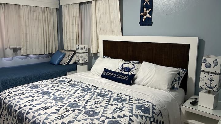 Spacious bedroom with a California King and a twin bed.