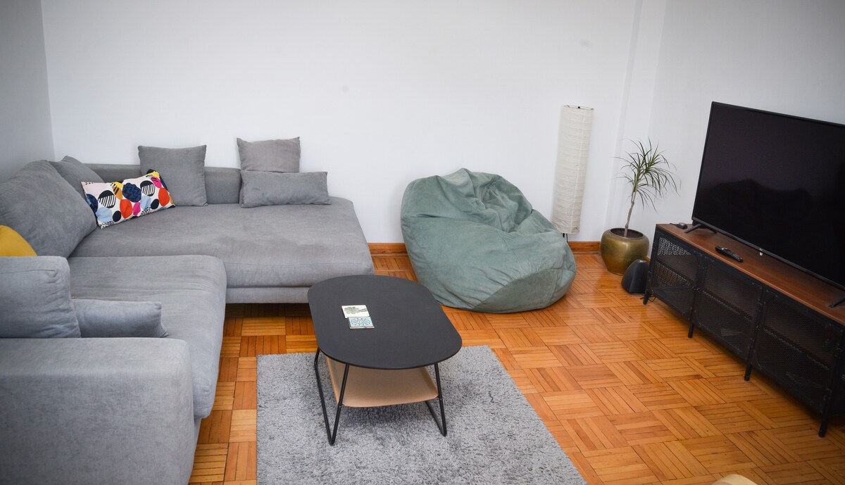 Cosy living room with a wide TV and soundsystem