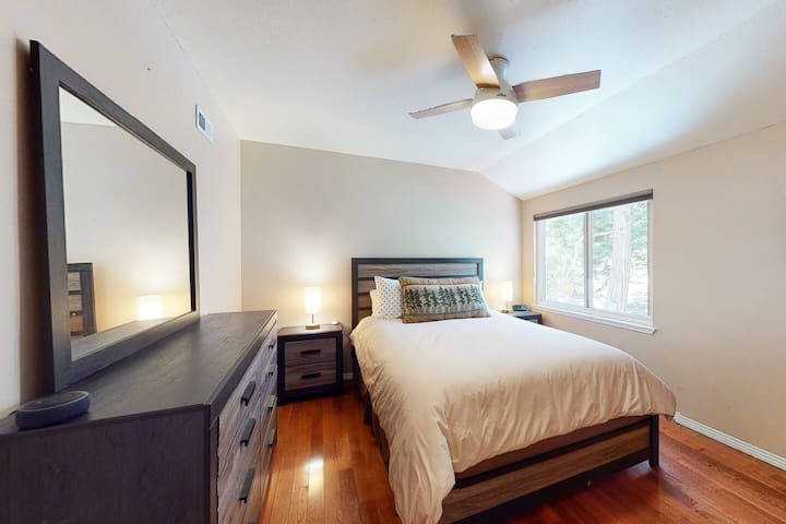 One of two bedrooms on second floor with queen bed, enjoy the view of our majestic trees.