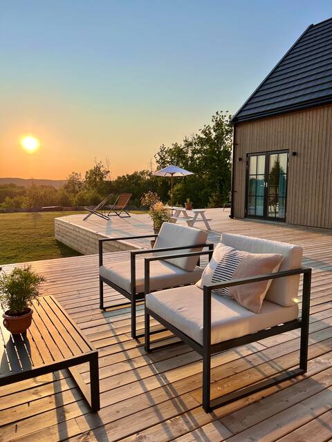 Modern barn house with large terrace & garden near lake
