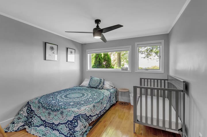 Bedroom 2 with a queen size bed and toddler bed. Tons of closet space for your storage needs. 