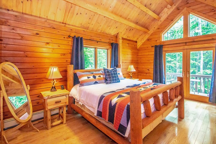 King sized master bedroom on first floor with French doors to private deck and gorgeous vaulted ceilings