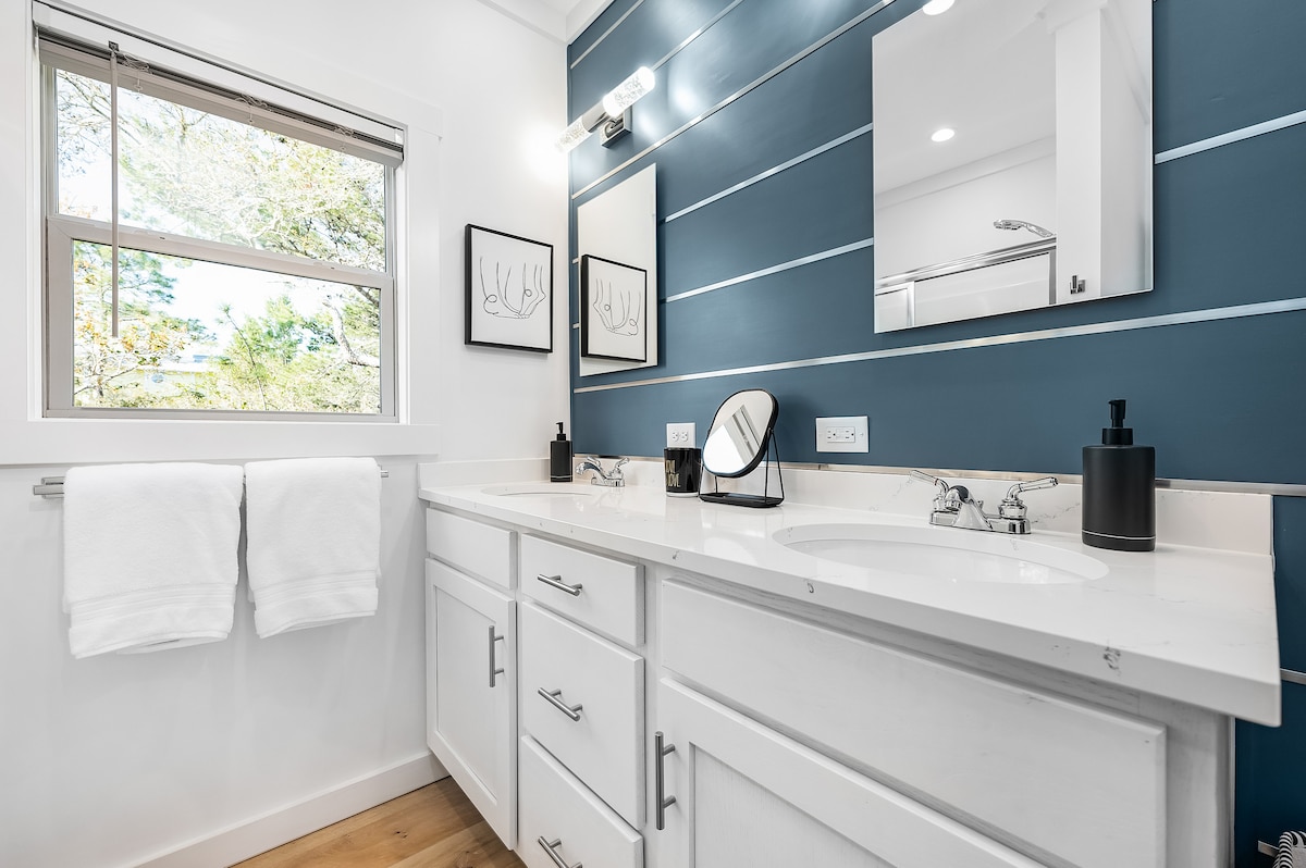 Double vanity in bathroom. Bath & beach towels, make-up mirror, hand soap, hair dryer, iron & board are provided. at Juan Love in Santa Rosa Beach