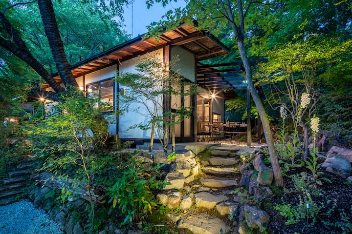 A private rental villa with a large Japanese-style room, a solarium with a grove view, and an outdoor terrace