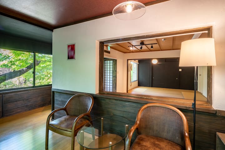 A private rental villa with a large Japanese-style room, a solarium with a grove view, and an outdoor terrace