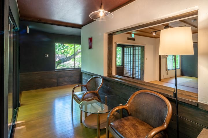 A private rental villa with a large Japanese-style room, a solarium with a grove view, and an outdoor terrace