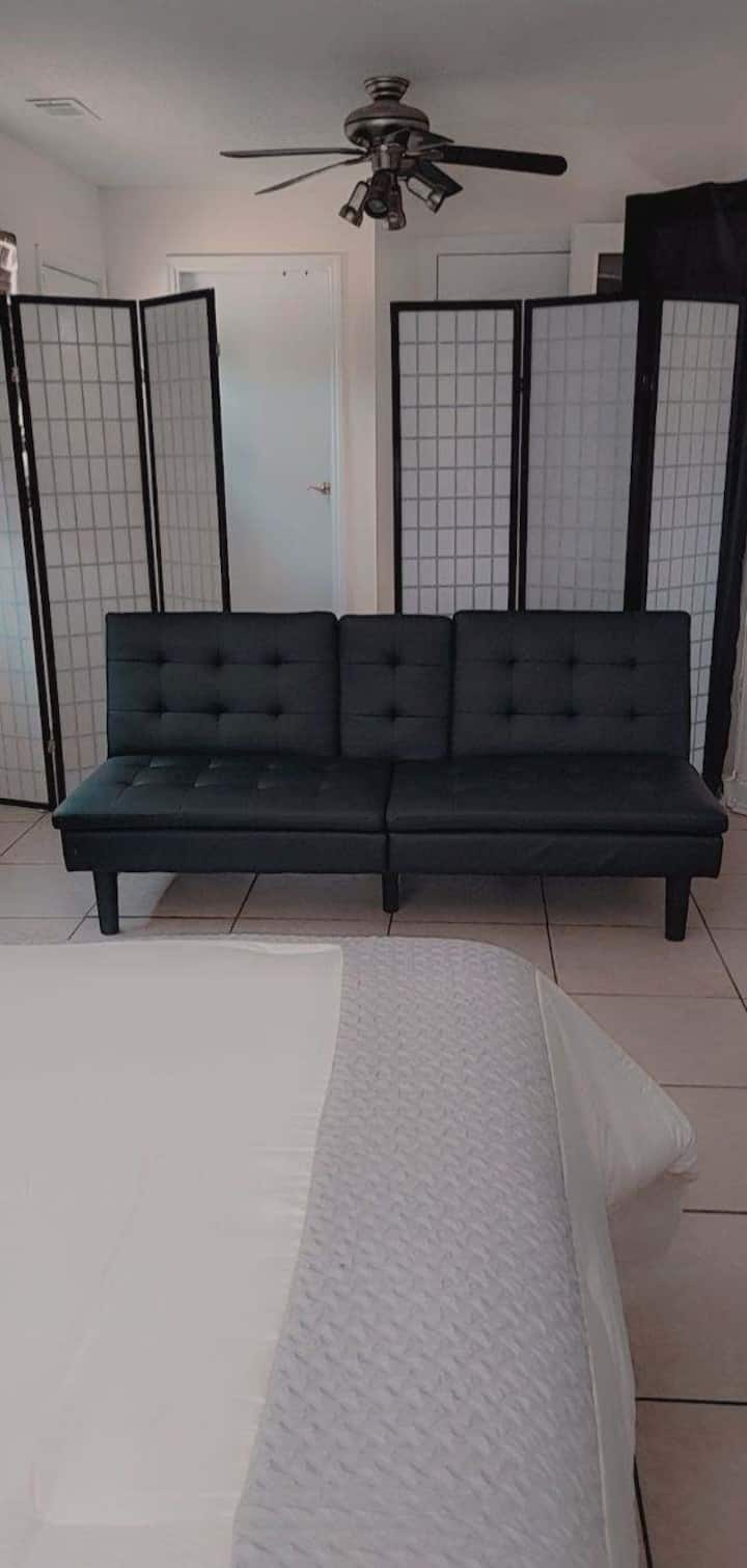 Futon and privacy divider in 2nd master suite. 