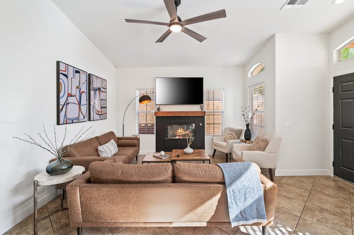 Additional living area with a fireplace and a 65" TV to enjoy a movie or a sports event!