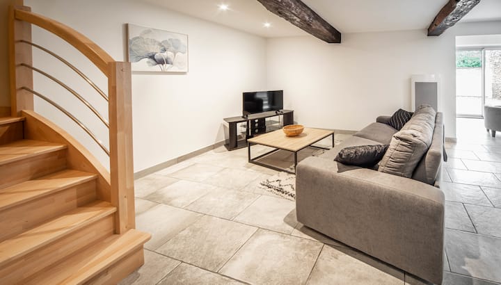 TV area with stairs to access the floor.