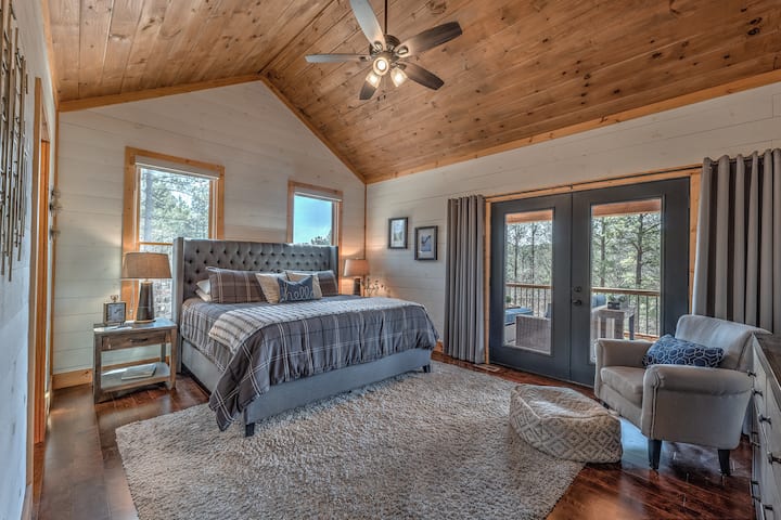 The chic master bedroom, with a comfortable king bed and room darkening shades, will provide for a perfect night's rest. 