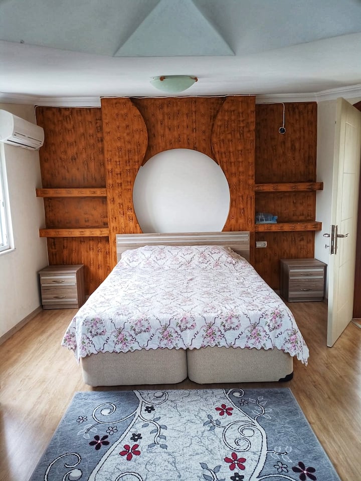 A double bedroom with air conditioning in the room, a spacious terrace and a bathroom on the floor