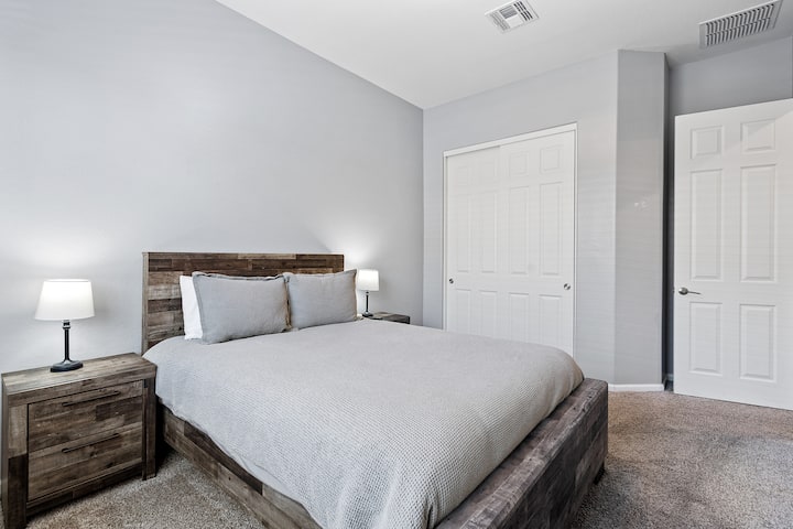 Bedroom #2 with king bed and flatscreen TV. 
