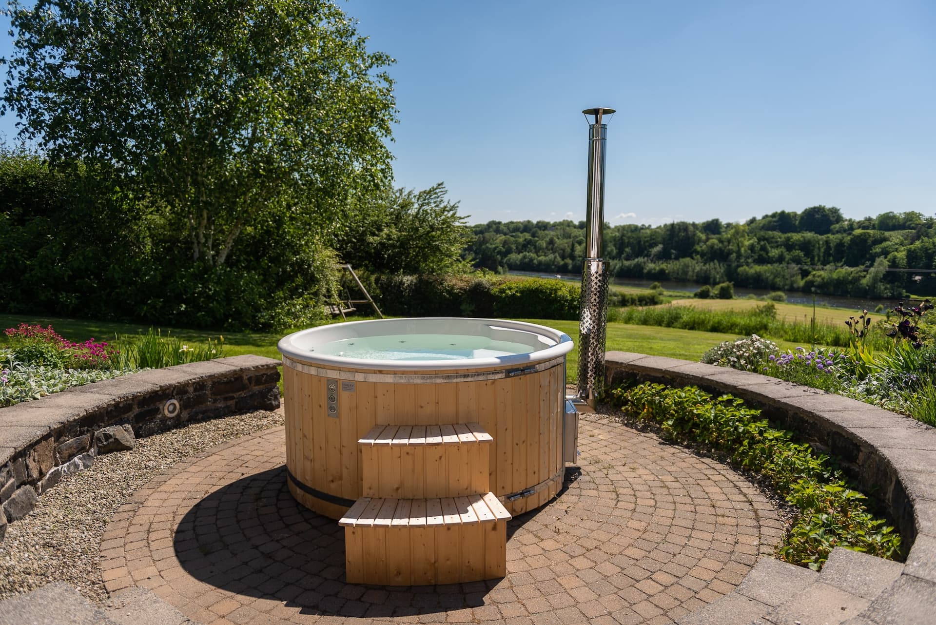 The log-fired hot tub above the River Bann