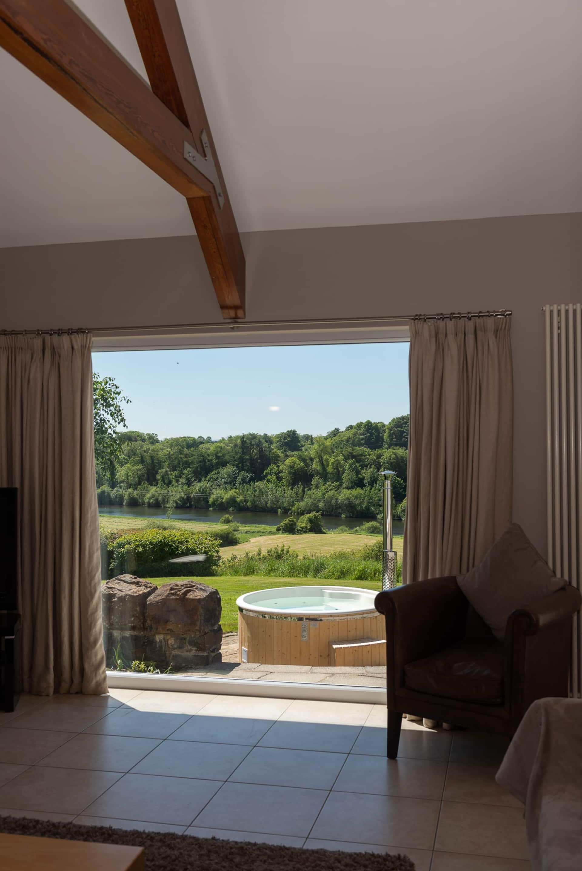 The view of the river through the doors at Dundarragh Lodge
