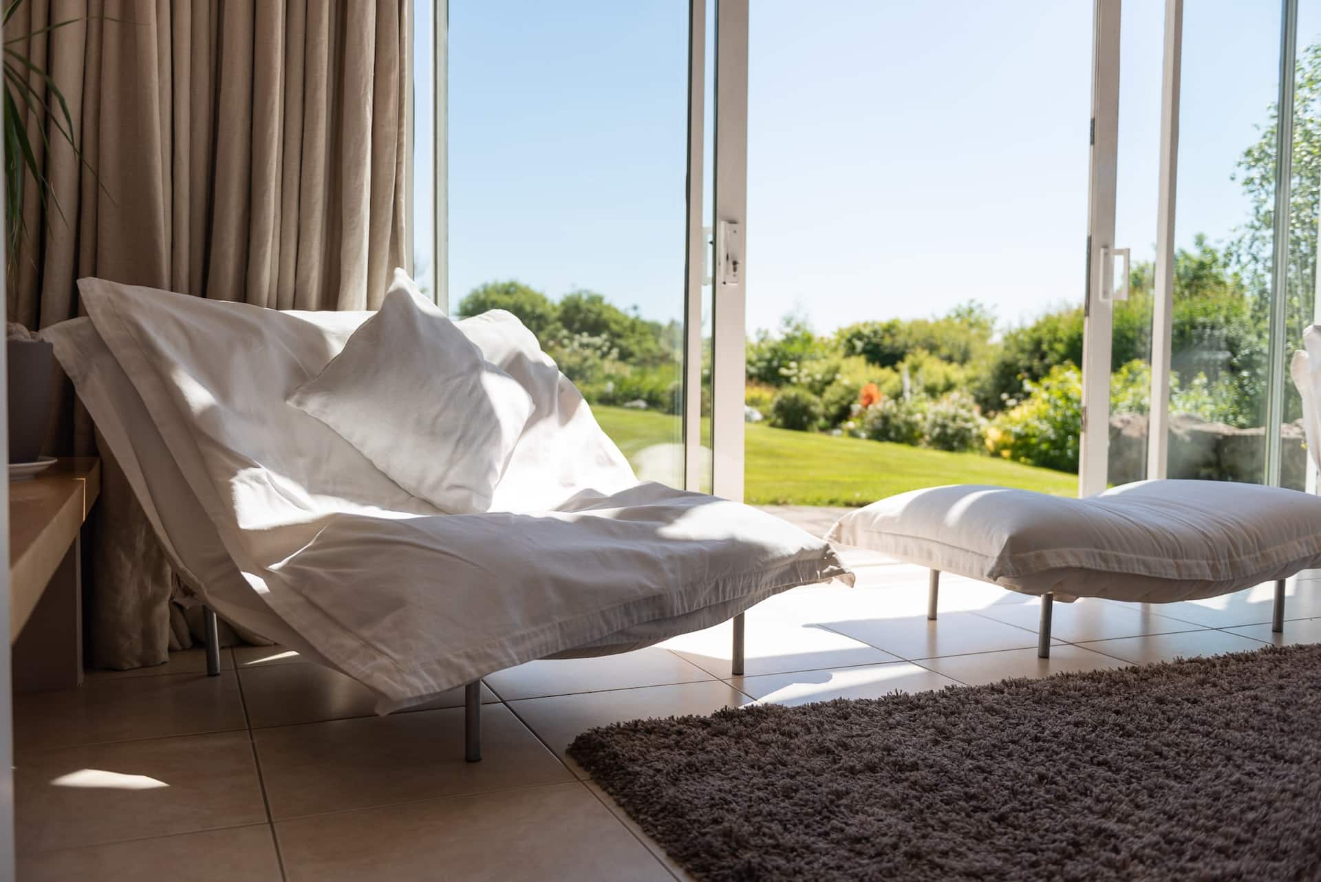 The living room at Dundarragh Lodge with views over the grounds