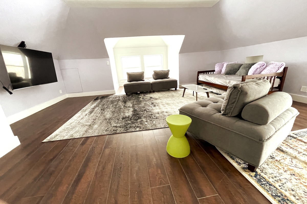 TV watching area on third floor.  Twin daybed has pull out twin trundle.  The large open area is perfect for group yoga. 