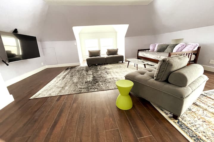 TV watching area on third floor.  Twin daybed has pull out twin trundle.  The large open area is perfect for group yoga. 