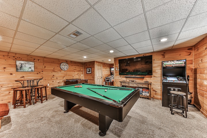 Basement.  Enjoy the 75" TV, Pool table, Foosball, Pinball, Arcade or some of the many board games with your family or friends.