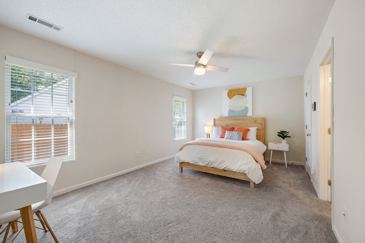 Master Bedroom with side tables for charging your phone at night. 