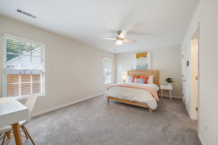 Master Bedroom with side tables for charging your phone at night. 