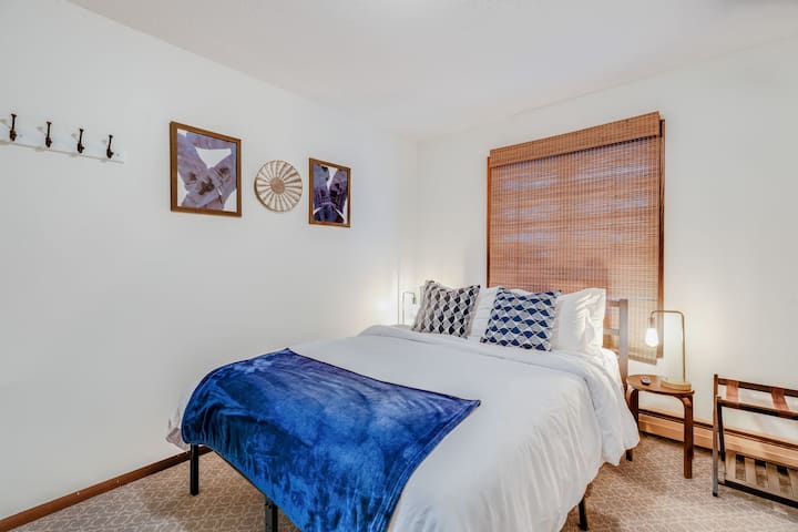 Bedroom 2 offers a queen bed and two single beds, perfect for families or groups. Separate a/c units in each bedroom.