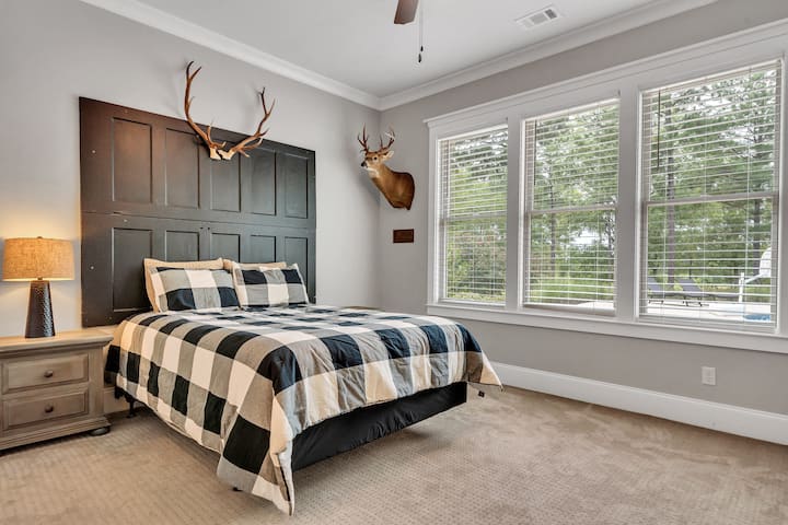 Bedroom #3 downstairs.  (Queen bed with great view).  This room has its own adjoining full bath.