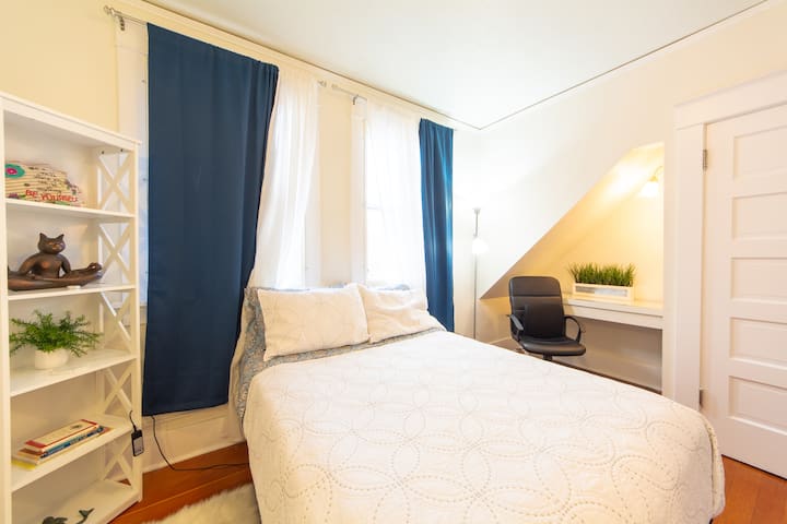 The softest bed in the house seen here in the 2nd floor Mediterranean Room. The full-sized bed is totally adjustable using the attached remote. Second work desk in well lit nook. Northern views of downtown Manitou Springs and the hills that surround.