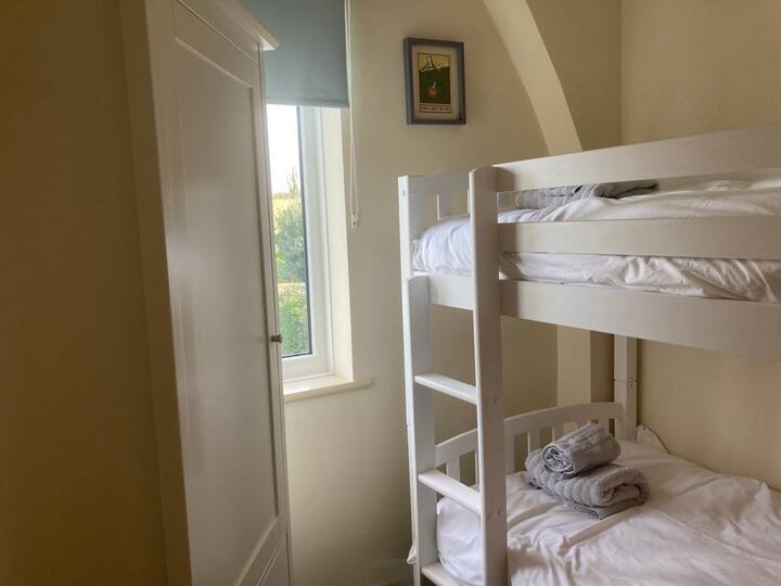 Rear facing bunk bed bedroom. Beds are larger size and suitable for adults. 
