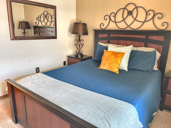 The downstairs bed features a comfortable mattress and new linens - the bathroom is adjacent.