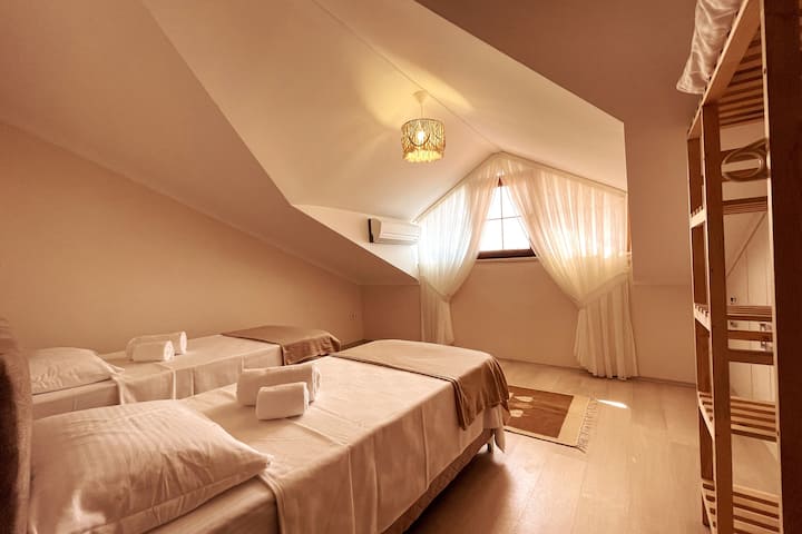 Our upper floor bedroom consisting of 2 single beds.
