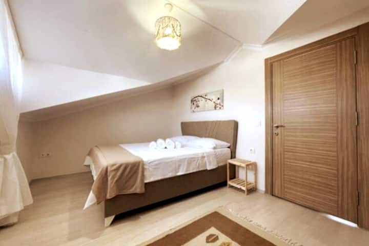 Our top floor bedroom consisting of a double bed.