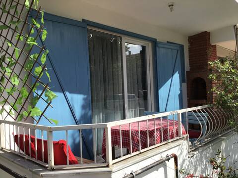 House with Blue Shutters/Your Only Tea Watering Flowers.