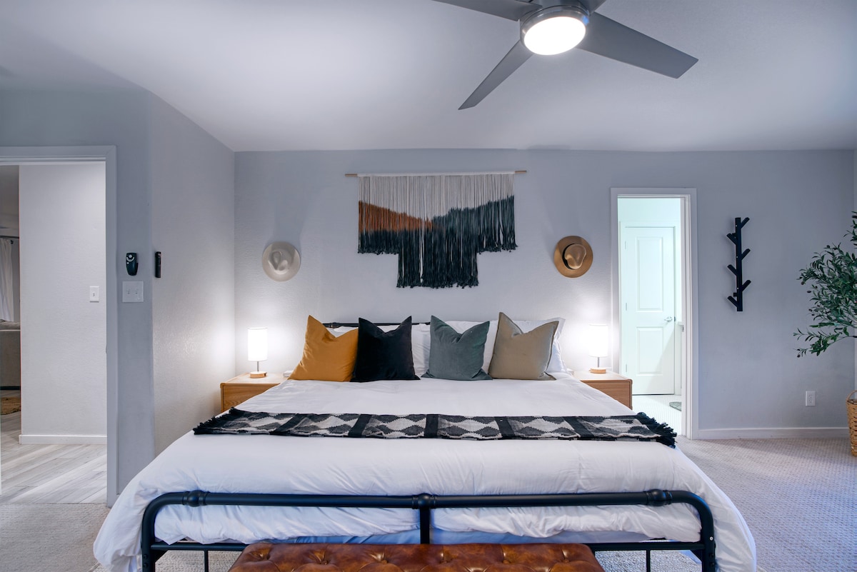 Primary bedroom with king-sized bed and on-suite bathroom.